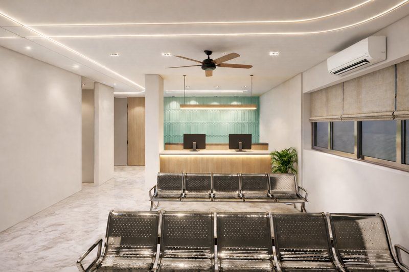 Clinic waiting area with seating facing the reception desk