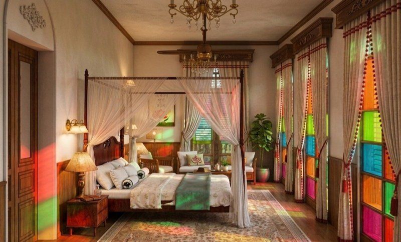 Bedroom with four-poster bed and coloured glass shutters casting colour across the room